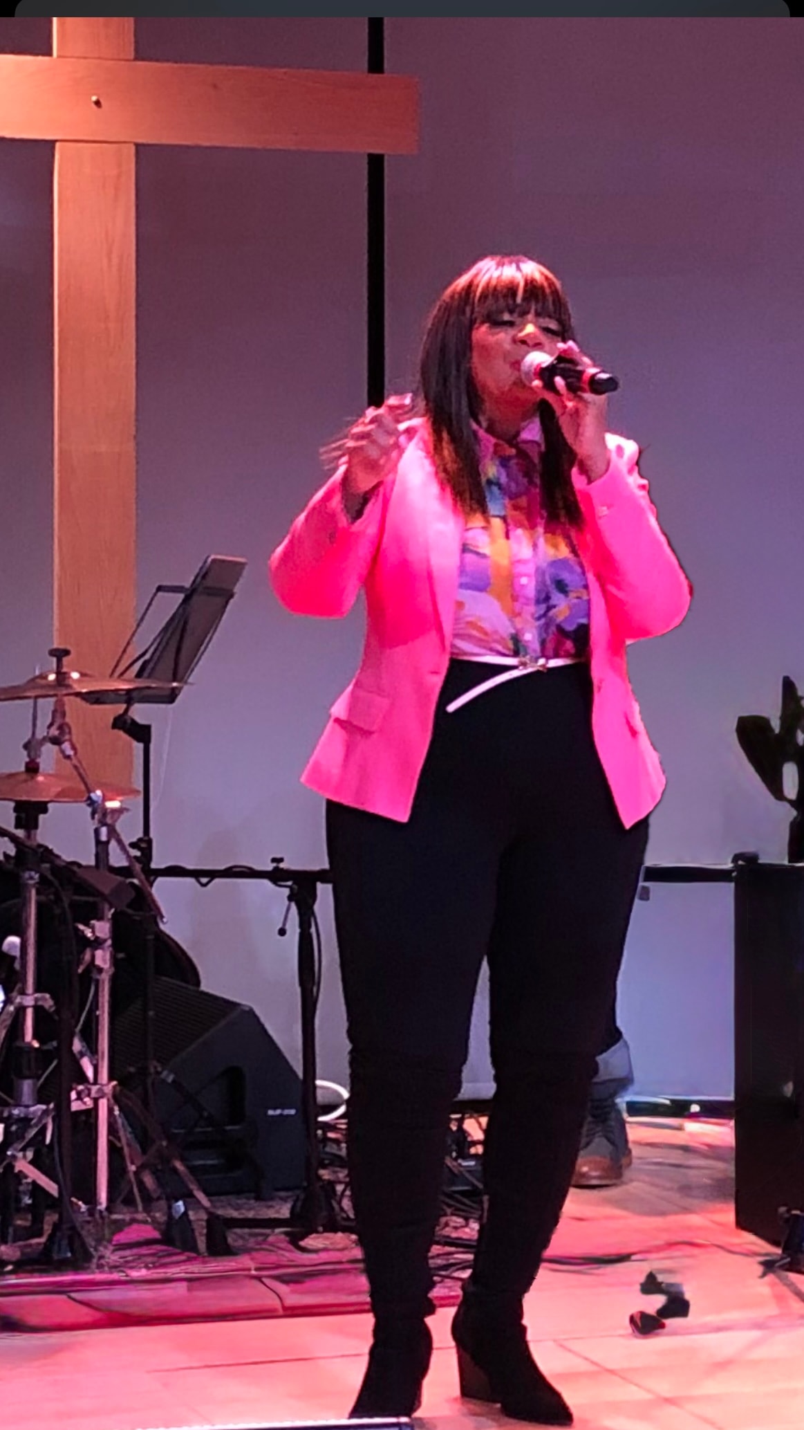 Stephanie Marinello performing in pink jacket